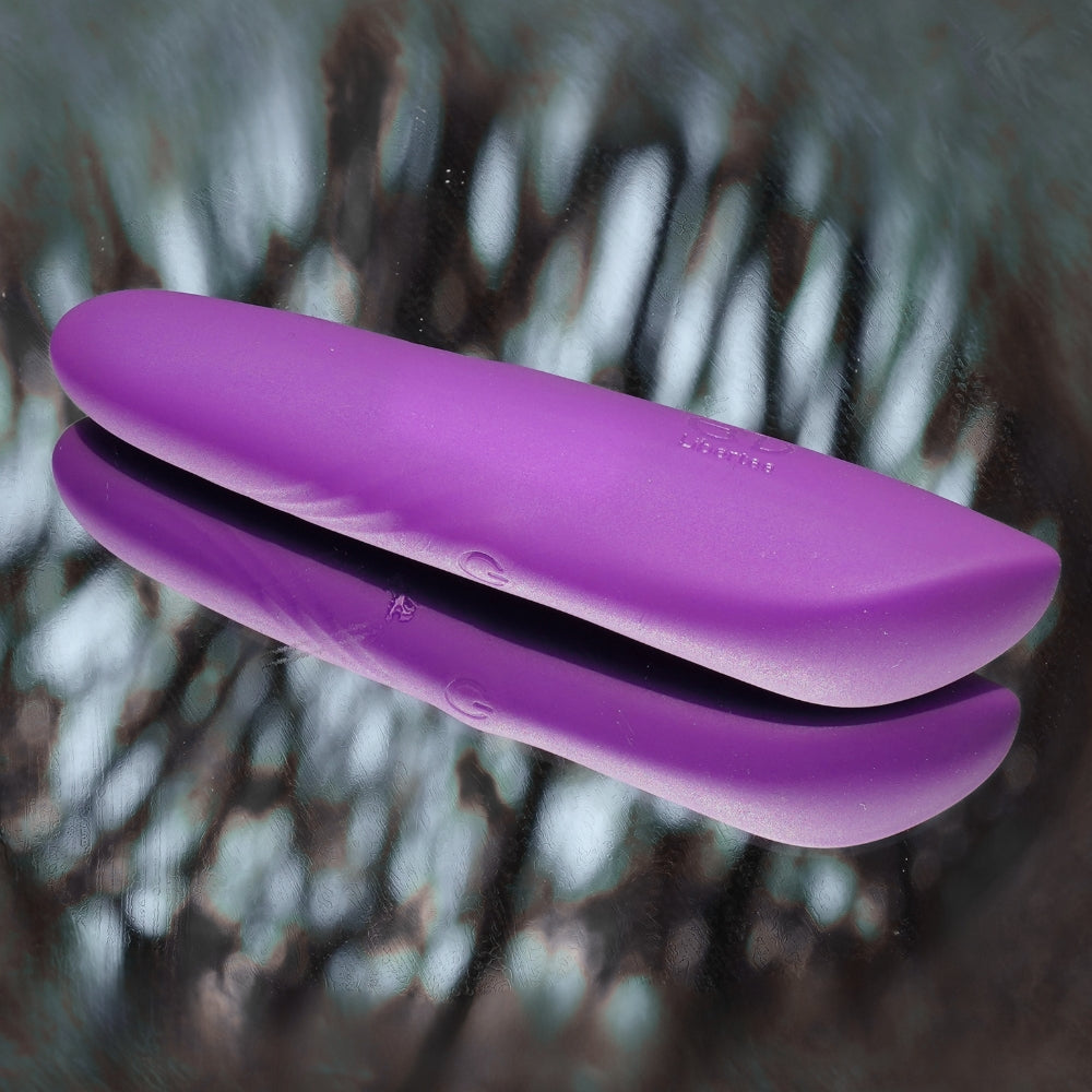 Purple Dia Mini bullet massager on a reflective surface, allowing to see every details and the smooth finish of the product